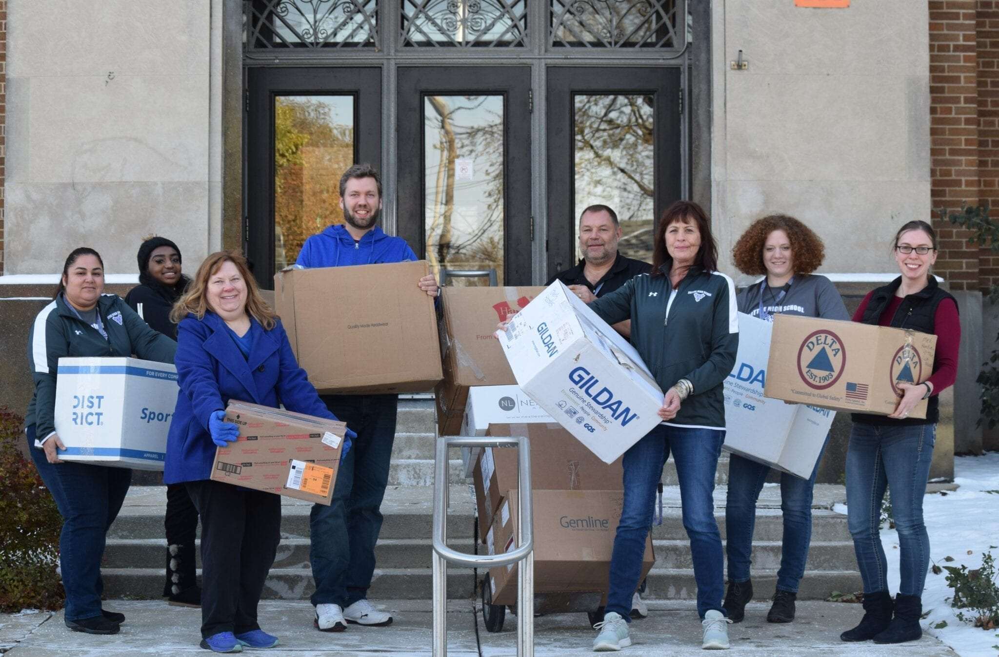 Members of the Magellan Promotions team delivering donations.